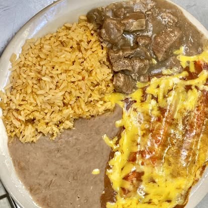 Carne guisada plate with rice, beans, and cheese-topped enchilada